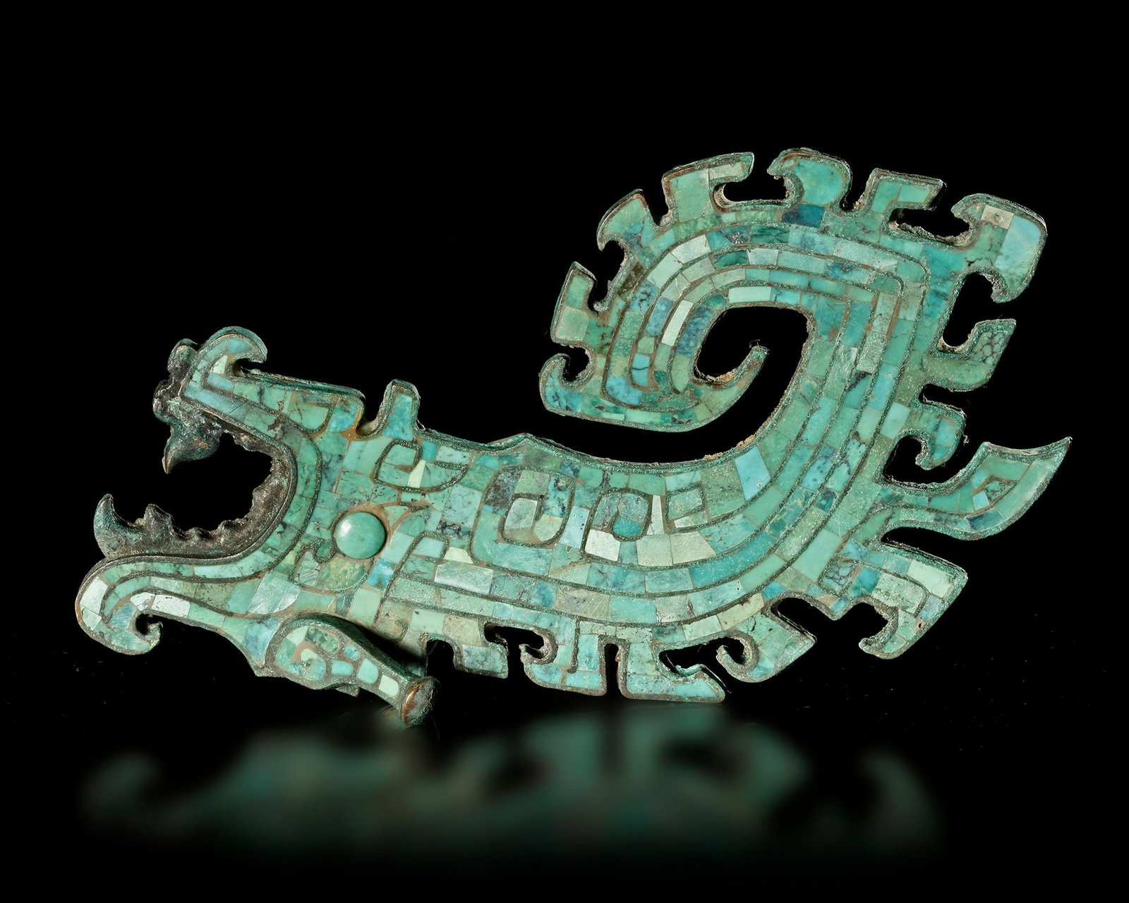 A BRONZE DRAGON WITH TURQUOISE INLAY, CHINA, SHANG DYNASTY: Height 16 cm. PROVENANCE Purchased in 1996 from Mr. Frank H. Crane, a Canadian antique dealer. His shop, "The Hundred Antiques" was located in Stirling, Ontario, Canada.