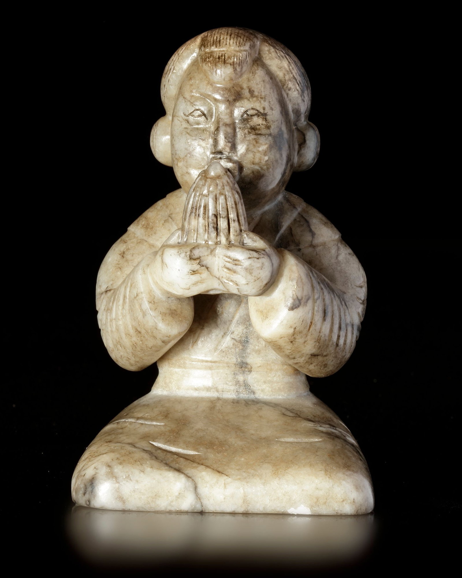 A CREAMY WHITE JADE OF A SHENG-PLAYING MUSICIAN, CHINA, HAN DYNASTY (206 BC-220 AD): 10 cm by 6.3 cm by 6.6.3 cm. PROVENANCE Purchased in 1996 from Mr. Frank H. Crane, a Canadian antique dealer. His shop, "The Hundred Antiques" was located in Stirling, Ontario, Canada.
