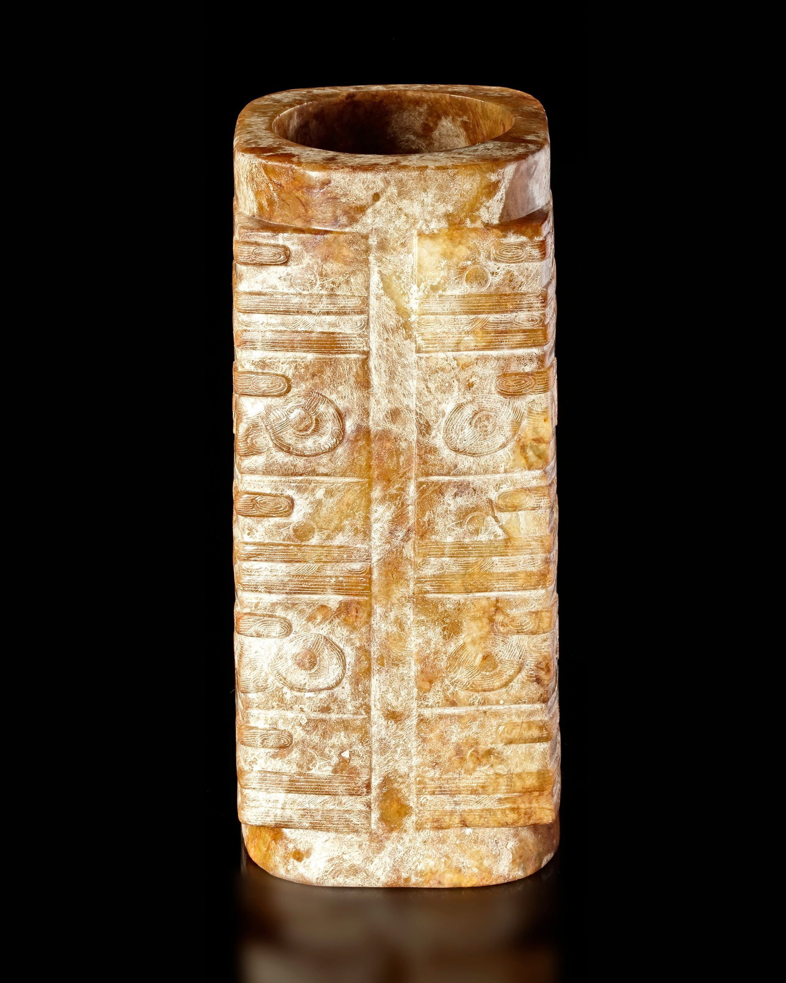 A YELLOWISH-BROWN MOTTLED FIVE-TIERED JADE CONG, CHINA, LIANGZHU CULTURE: Height 18 cm. PROVENANCE Purchased in 1996 from Mr. Frank H. Crane, a Canadian antique dealer. His shop, "The Hundred Antiques" was located in Stirling, Ontario, Canada. Reference: Jessica Rawson â&e