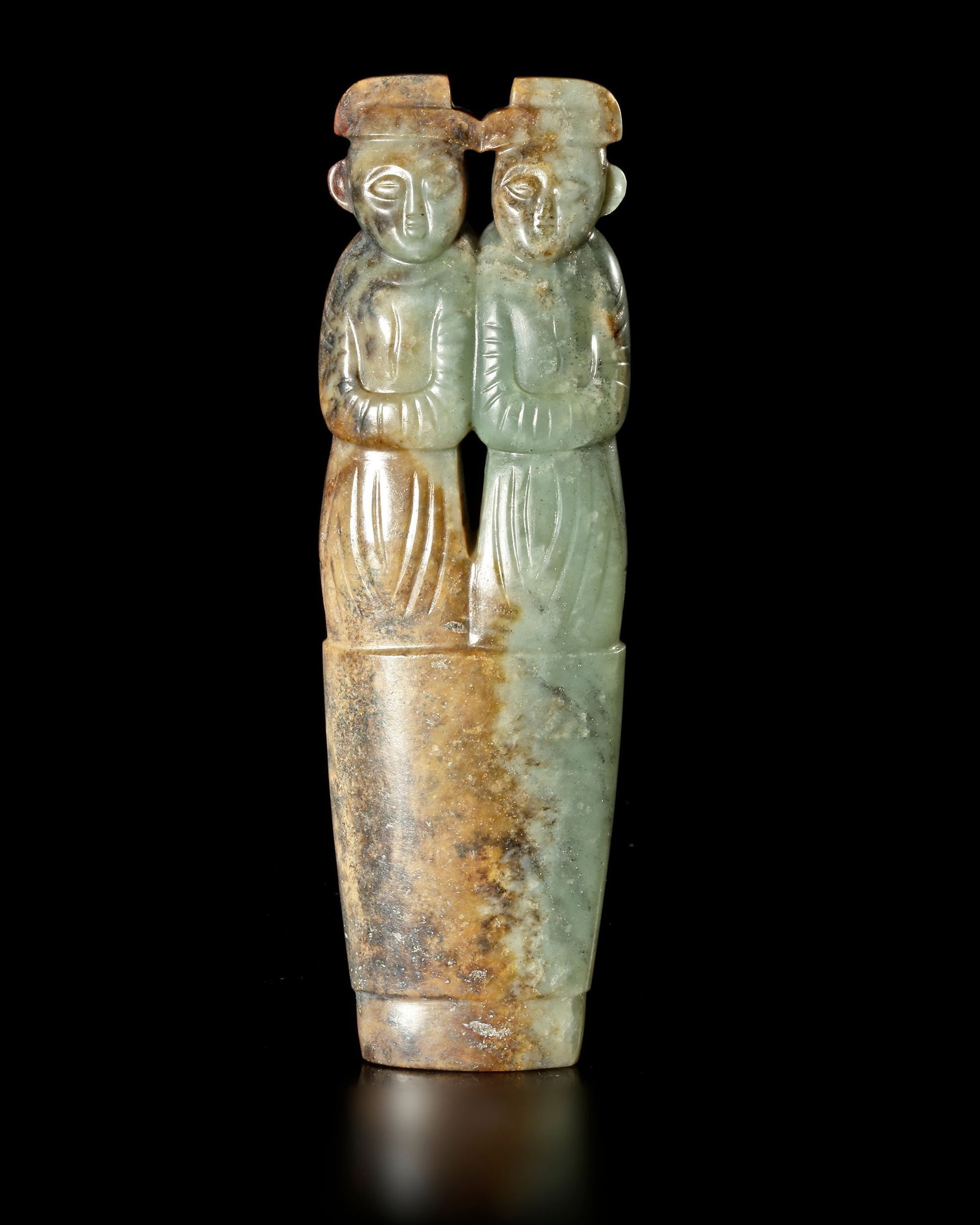 A PAIR OF GREEN JADE HUMAN FIGURES, TWINS, â€?BING XING QI', CHINA, HAN DYNASTY (206 BC-220 AD): 12.7 cm by 3.9 cm by 1.7 cm. PROVENANCE Purchased in 1996 from Mr. Frank H. Crane, a Canadian antique dealer. His shop, "The Hundred Antiques" was located in Stirling, Ontario, Canada.