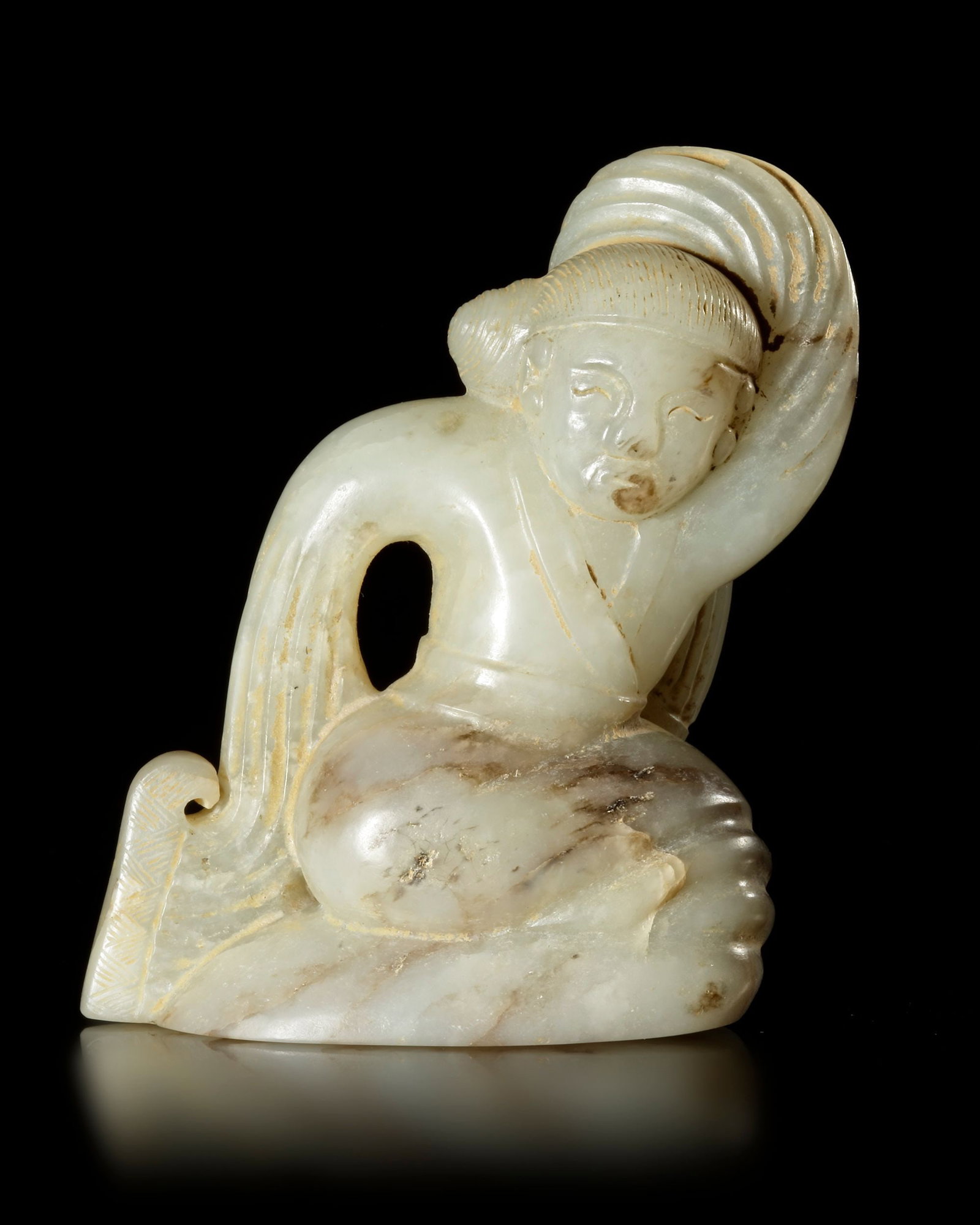 A WHITE JADE OF A DANCING WOMAN, CHINA, HAN DYNASTY (206 BC-220 AD): 6.9 cm by 5.3 cm by 2.7 cm, PROVENANCE Purchased in 1996 from Mr. Frank H. Crane, a Canadian antique dealer. His shop, "The Hundred Antiques" was located in Stirling, Ontario, Canada. Reference: Jessi