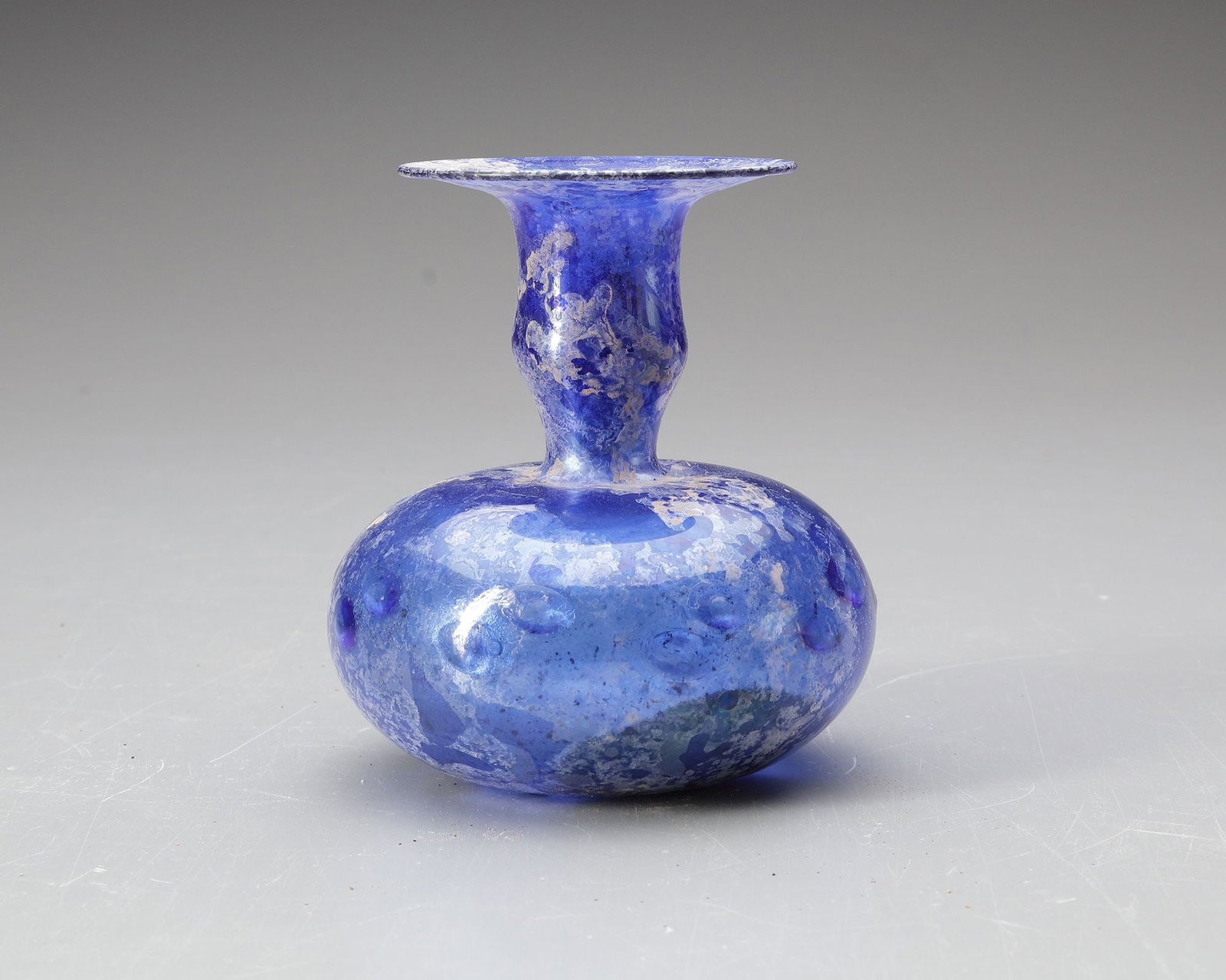 A BLUE GLASS BOTTLE, PERSIA OR SYRIA, 11THâ€“12TH CENTURY (1 of 4)