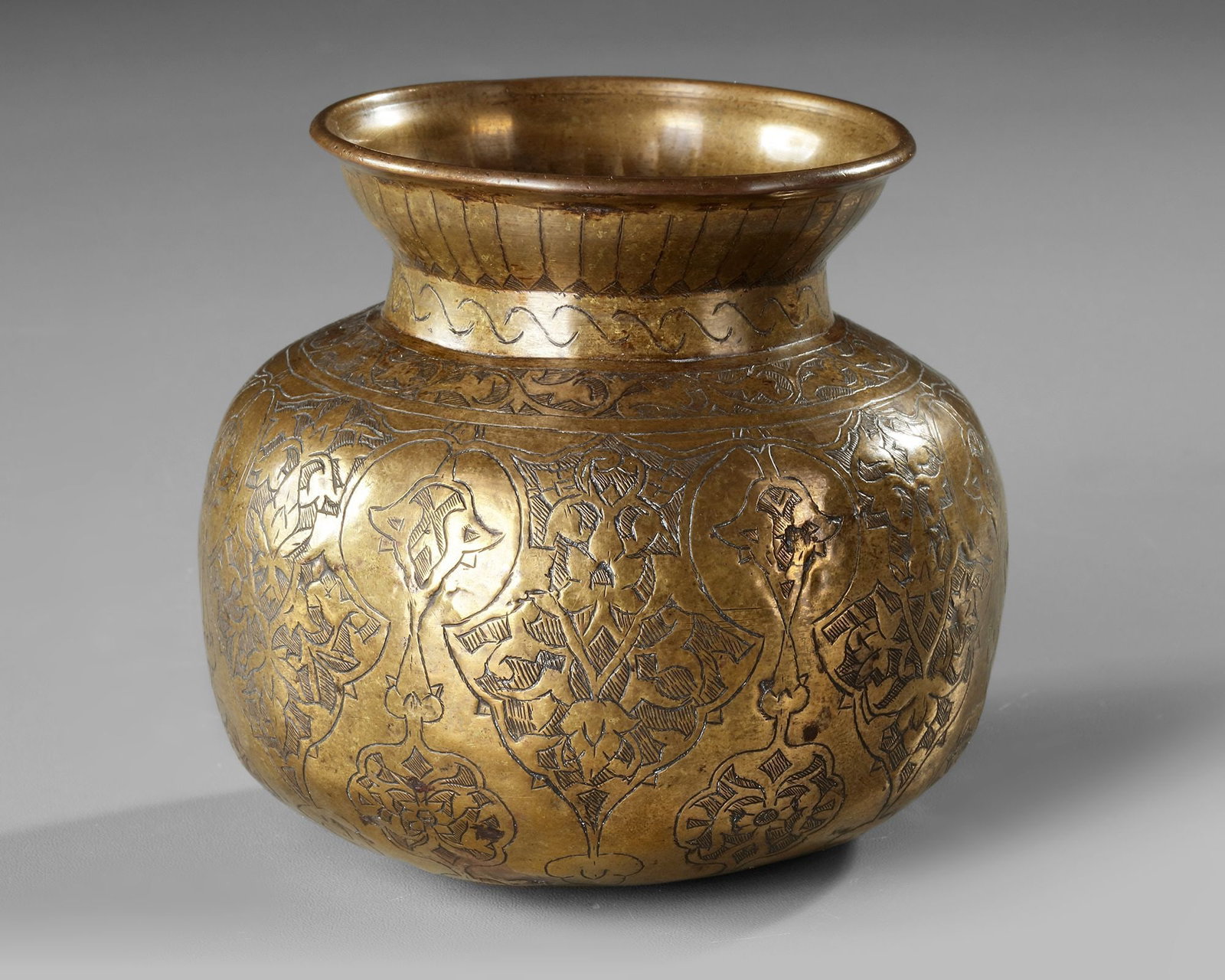 A QAJAR ENGRAVED BRASS VASE, PERSIA, EARLY 19TH CENTURY (1 of 4)