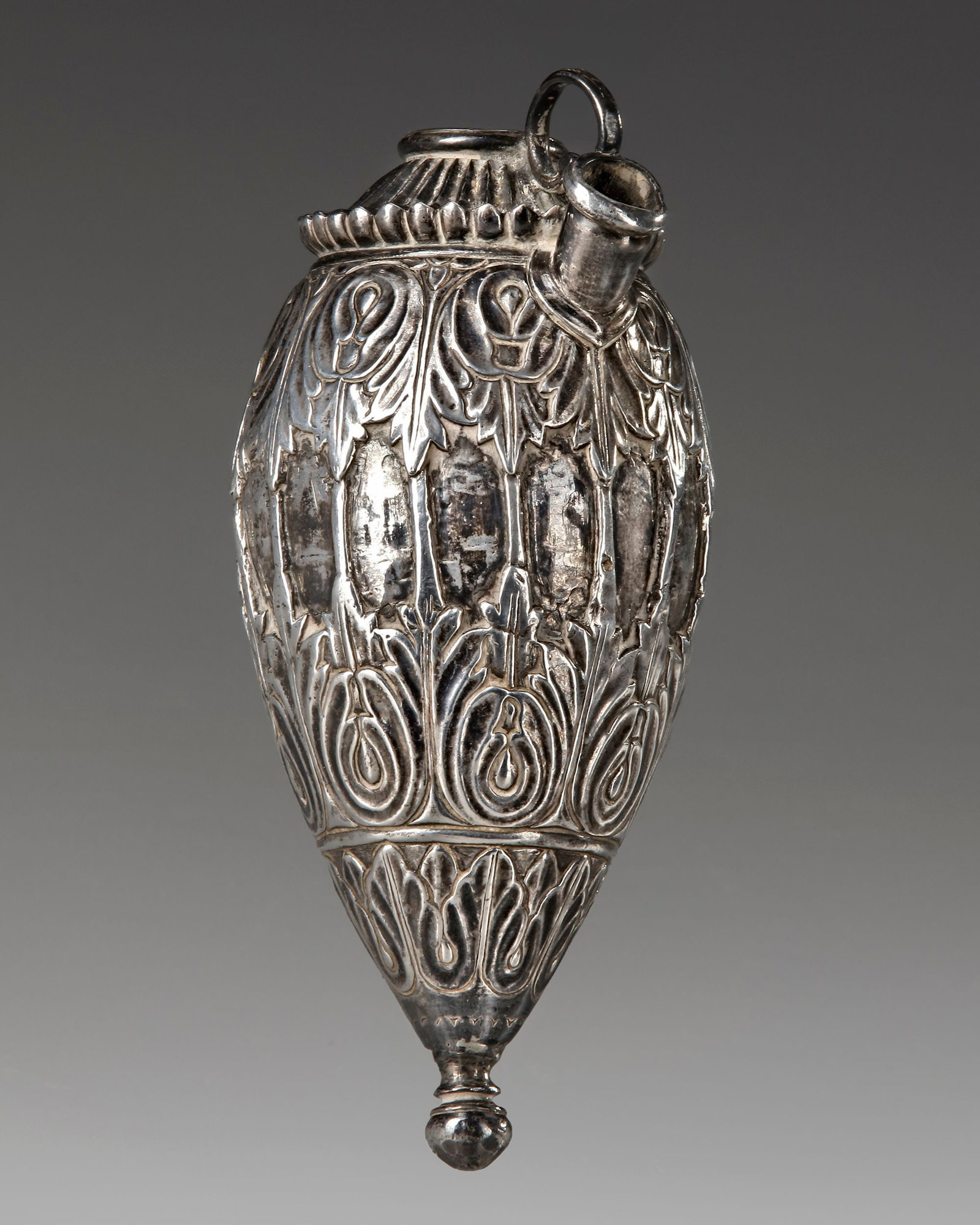 AN INDIAN SILVER HOOKAH BASE, 19TH CENTURY: Of accentuated inverted drop-shape with pointed lower terminal. Length 12 cm. 237 gr.