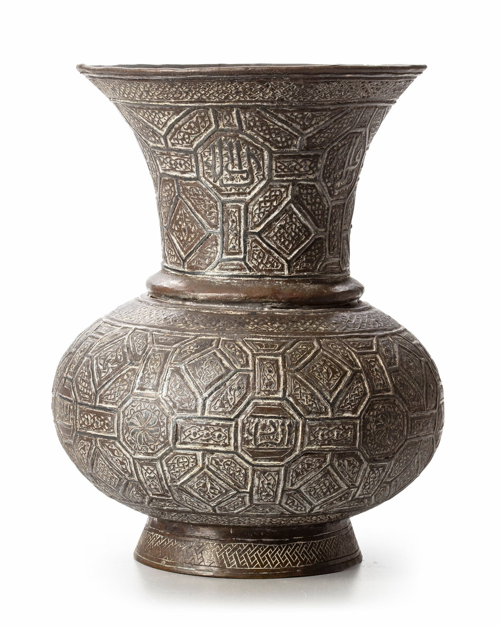 A SILVER-INLAID BRONZE VASE, 19TH CENTURY: Of baluster form with a globular body rising to a waisted neck and broad flaring rim, the bronze surface extensively decorated with silver inlay. The body and neck are divided into a dense geometric n