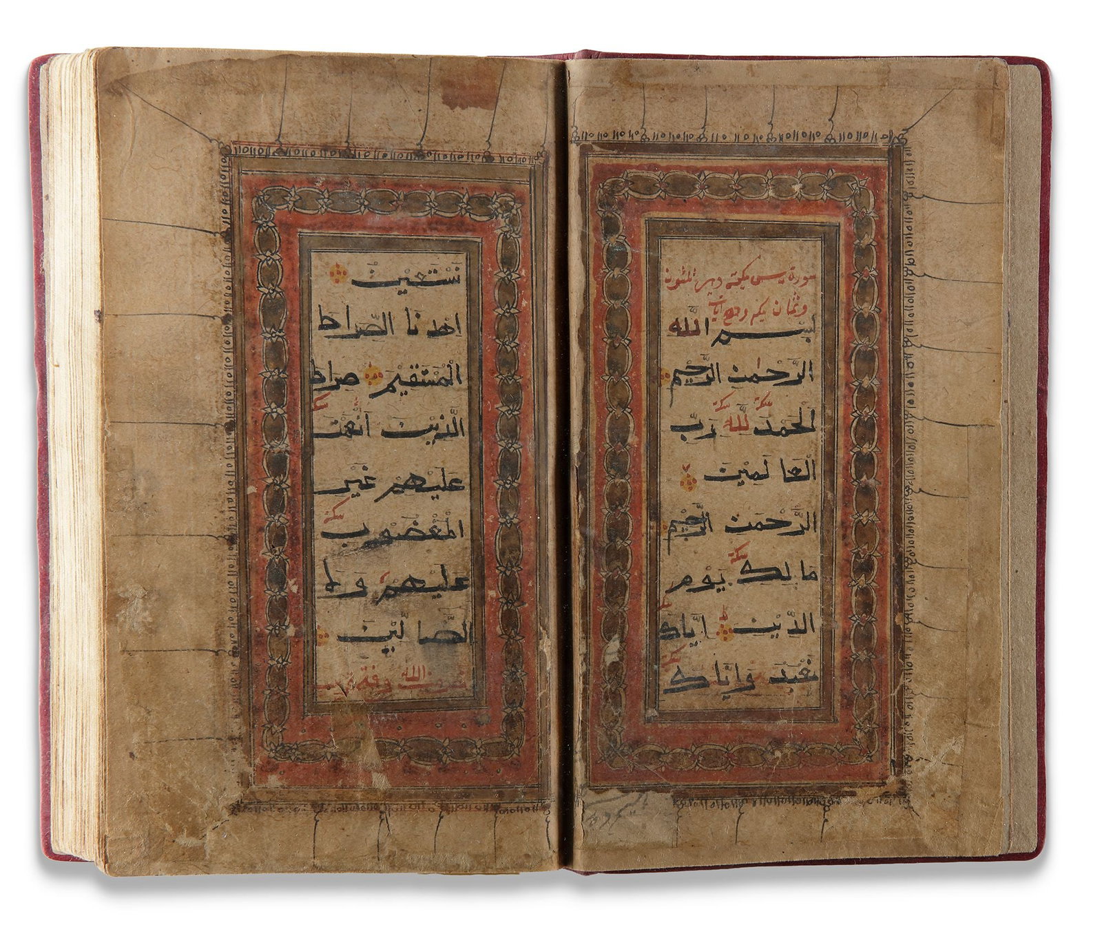 AN ILLUMINATED BIHARI DEVOTIONAL MANUSCRIPT, INDIA 17TH/18TH CENTURY: Arabic devotional manuscript on paper, each page arranged in 13 lines of black Bihari script. Qurâ€™anic verses are marked by yellow-gold rosettes outlined with red dots, while surah headings 