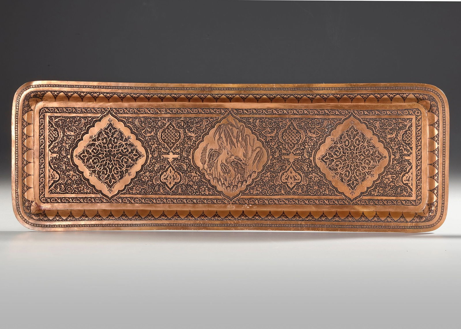 A PERSIAN ENGRAVED RED COPPER TRAY, 20TH CENTURY (1 of 4)