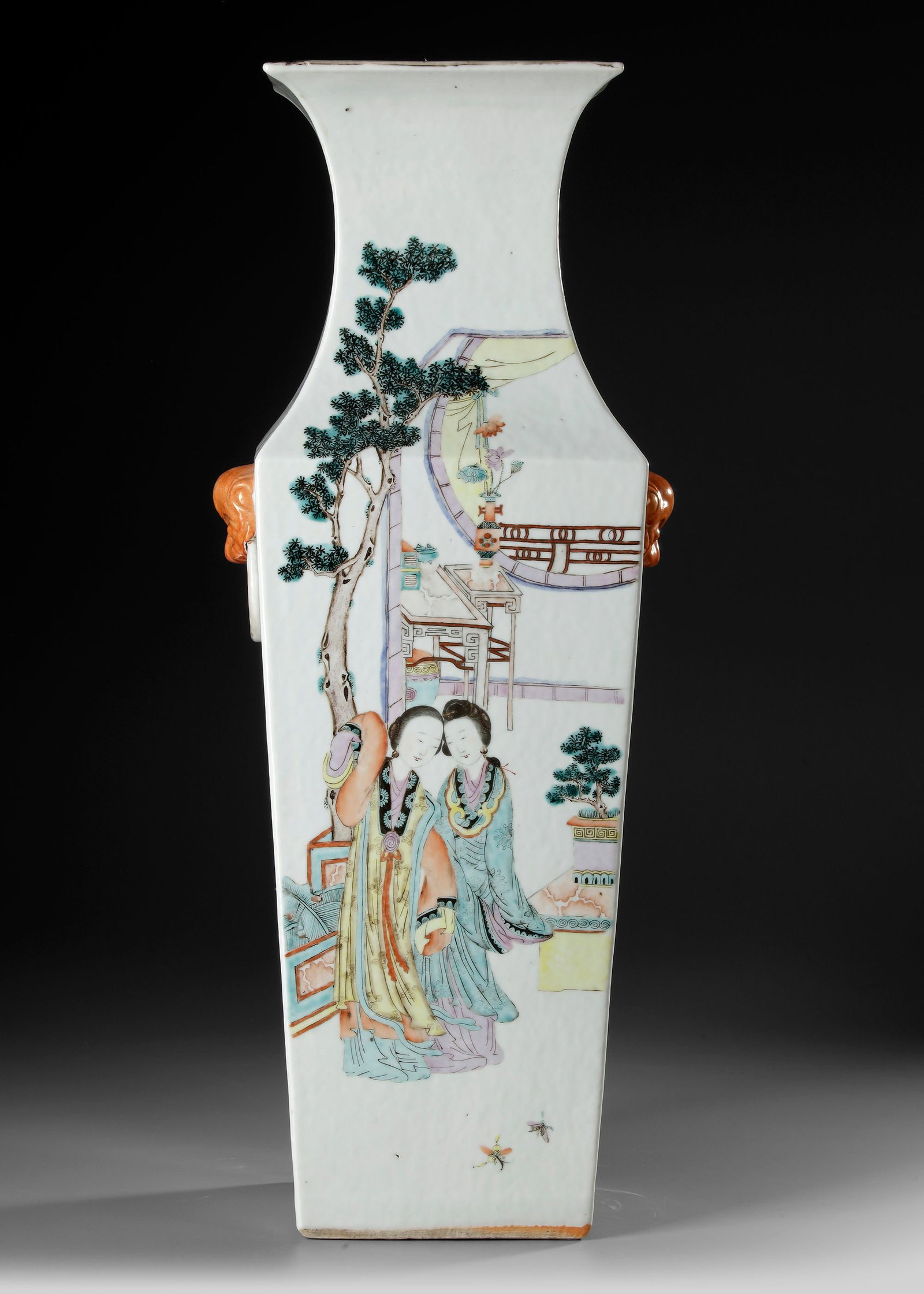 A LARGE CHINESE FAMILLE ROSE SQUARE-FORM VASE, 19TH CENTURY: Of elegant square form with waisted neck and flared rim, finely painted in the famille rose palette with elegant ladies in flowing robes within a garden setting, accompanied by children, trees and arc
