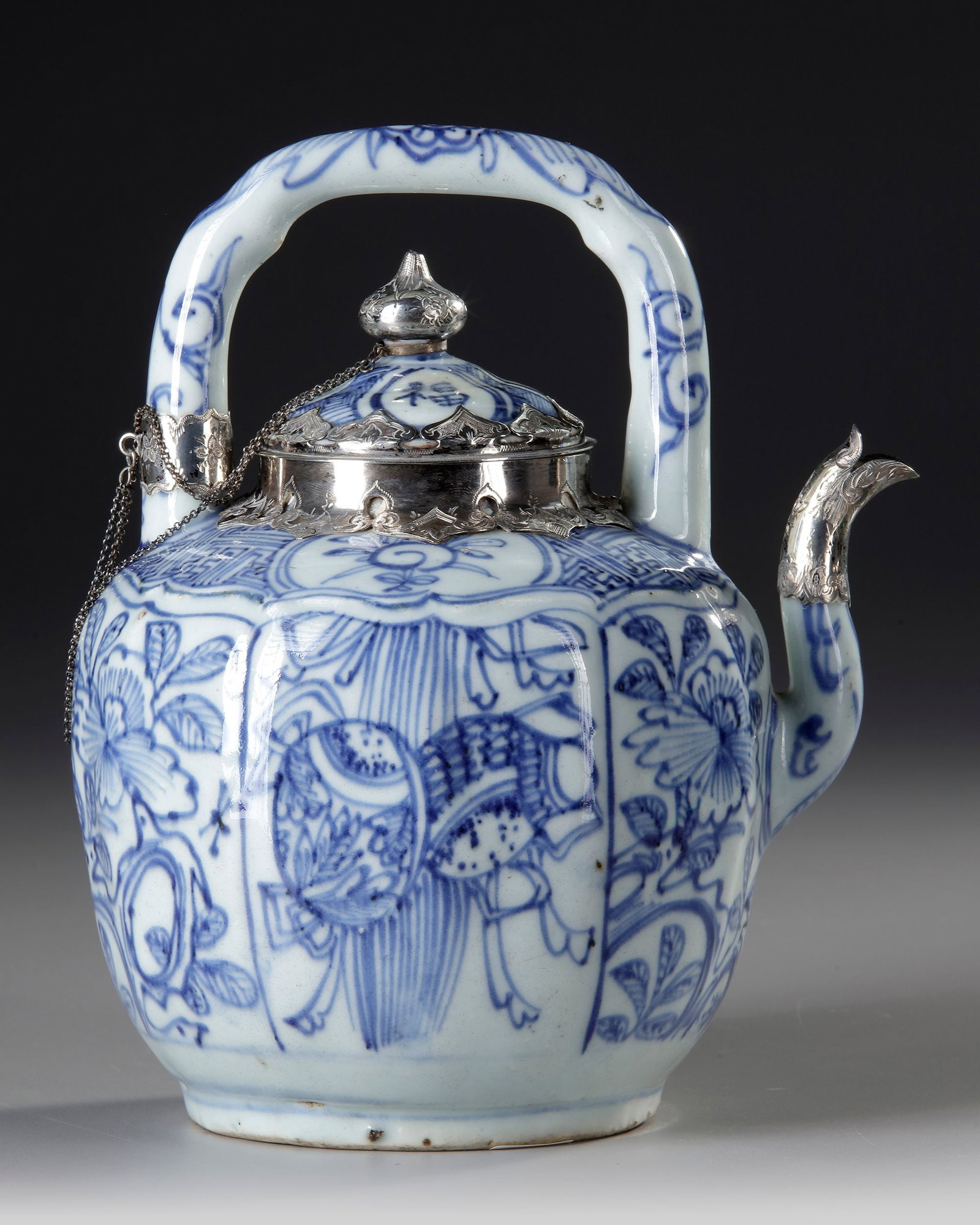 A CHINESE BLUE AND WHITE TEAPOT WITH SILVER MOUNTING, WANLI PERIOD, (1573-1619) (1 of 4)