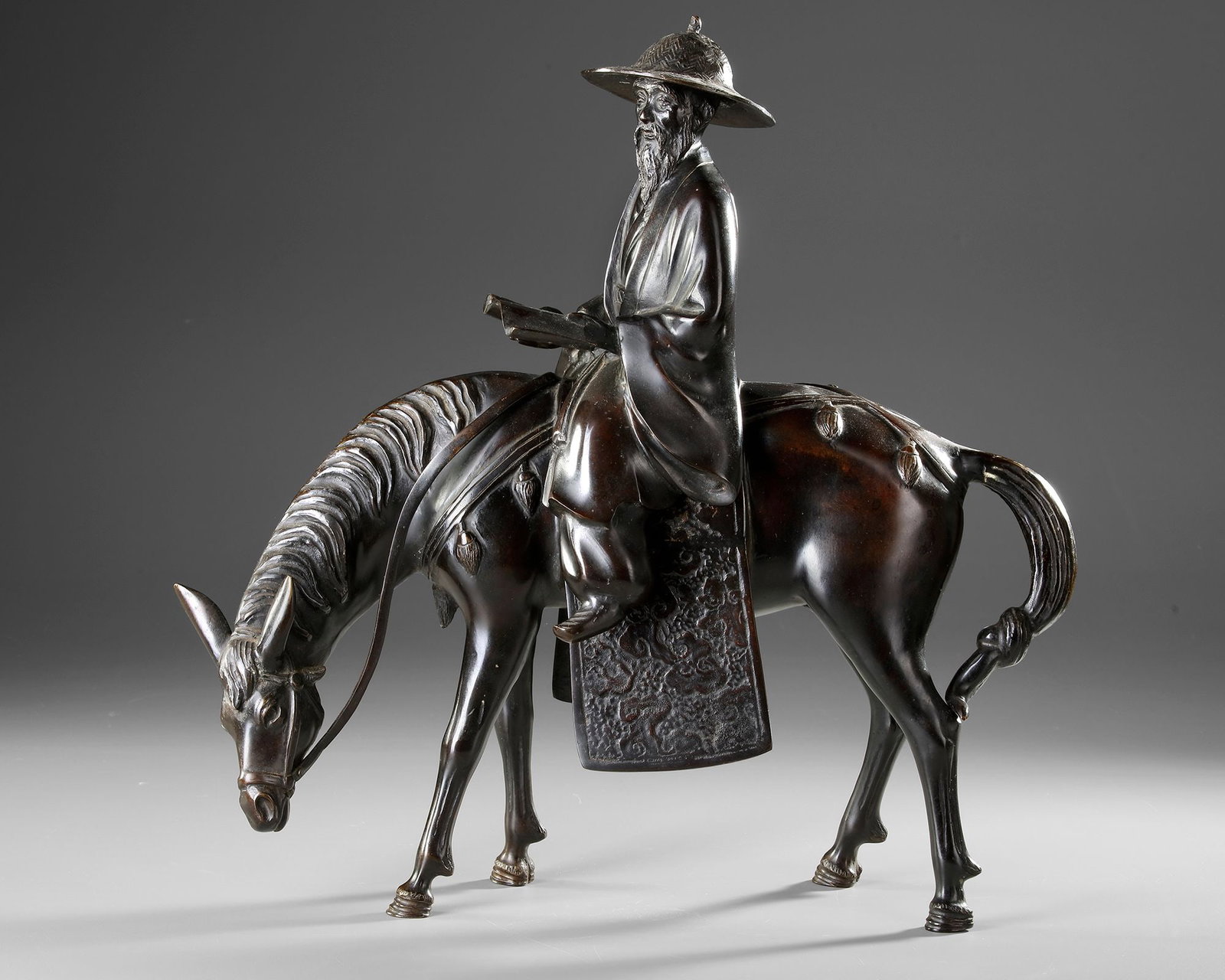 A CHINESE BRONZE FIGURE OF A SCHOLAR RIDING A DONKEY,19TH CENTURY (1 of 4)