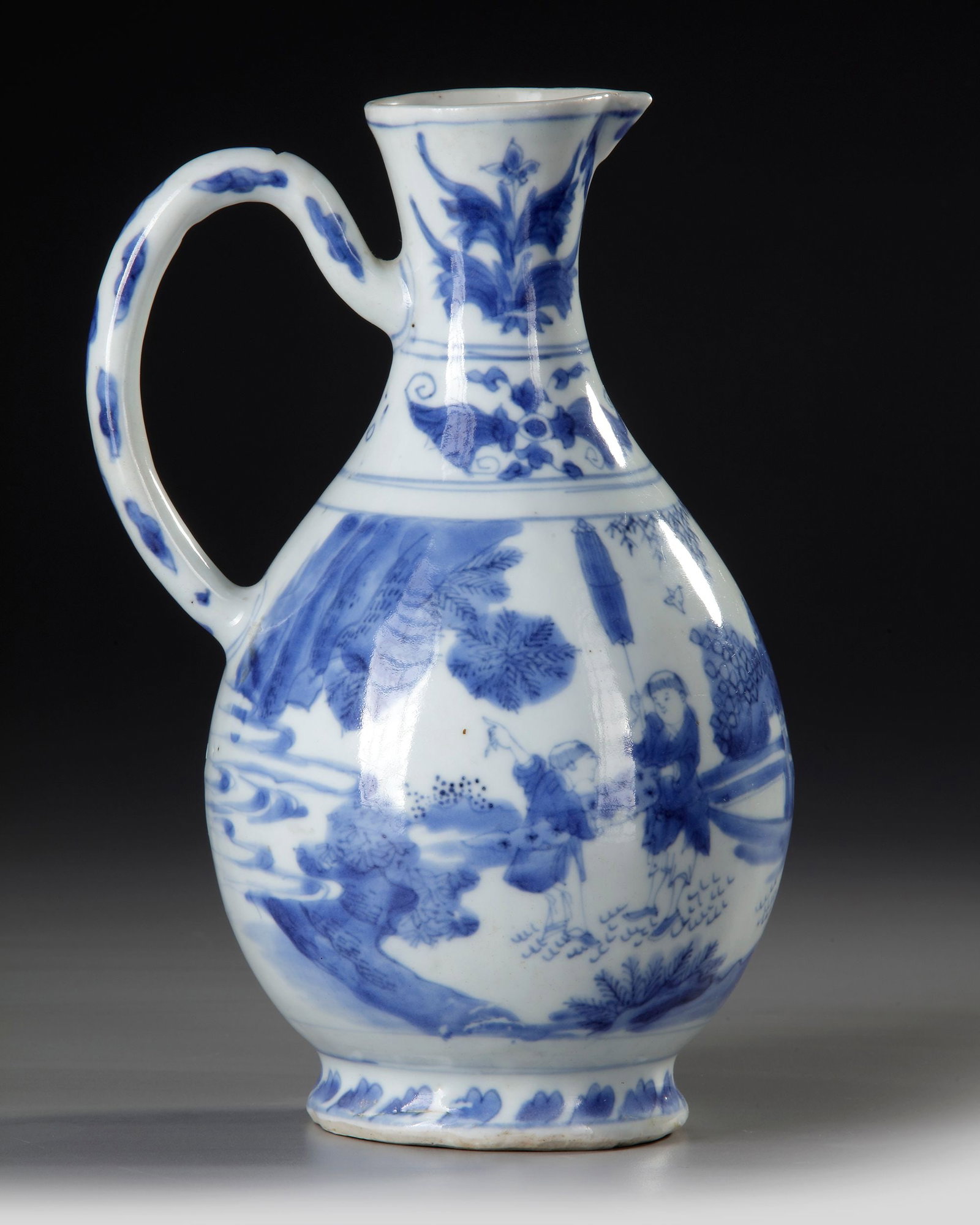 A CHINESE BLUE AND WHITE EWER, TRANSITIONAL PERIOD, 17TH CENTURY (1 of 3)
