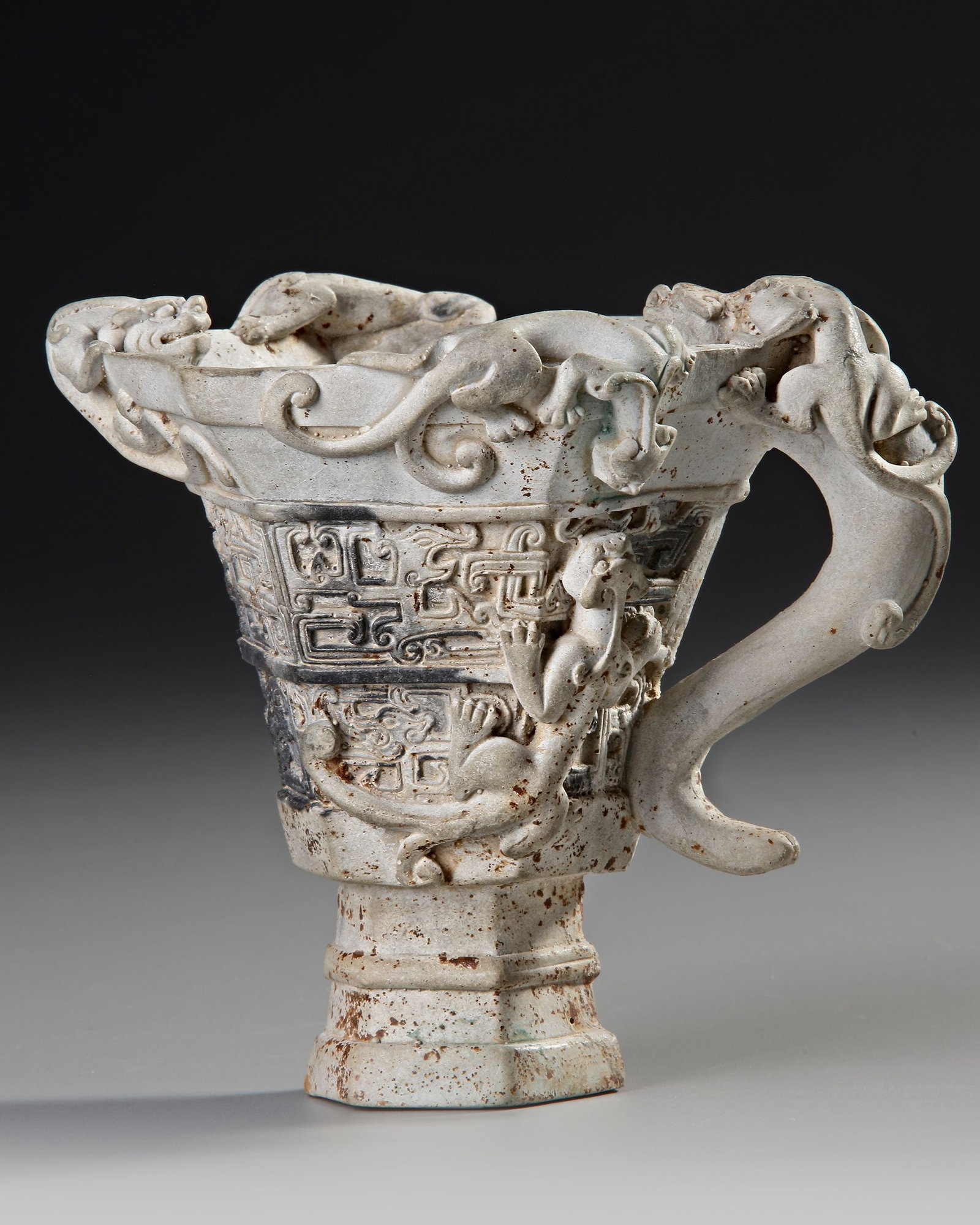 A CHINESE BISCUIT PORCELAIN BEAKER, 17TH CENTURY (1 of 4)