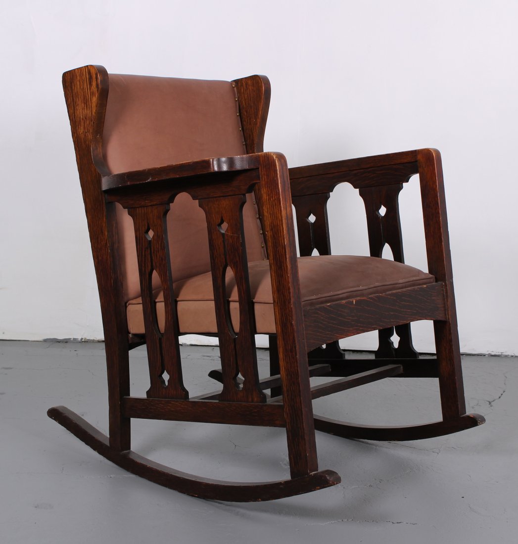 Arts and Crafts Oak Rocker: Arts and Crafts Oak Rocker. Leather back and seat. Size: 34.5 x 27.5 x 33 inches.