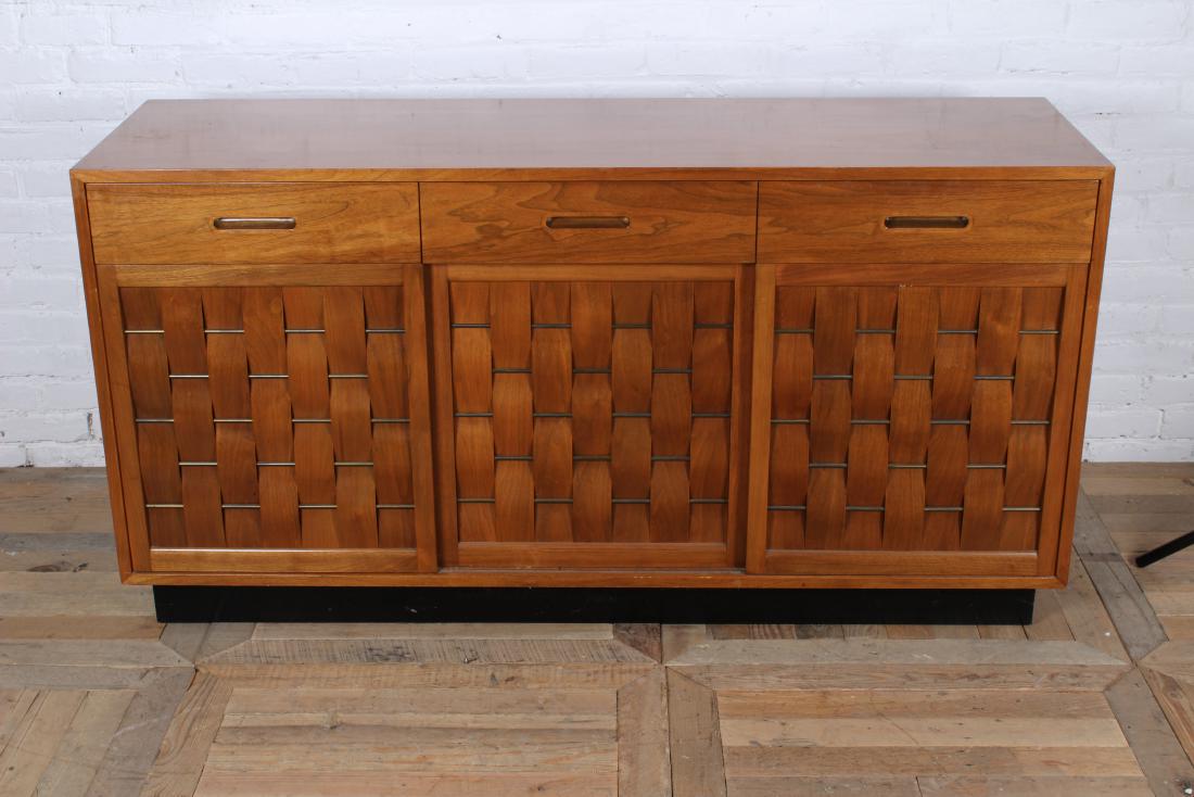 Edward Wormley for Dunbar Woven Front Sideboard: Very good Edward Wormley for Dunbar woven front sideboard with 3 drawers over 3 woven sliding doors all raised on inset Plinth base. Circa 1950. Size: 31 1/2" H x 61 1/2" W x 18" H