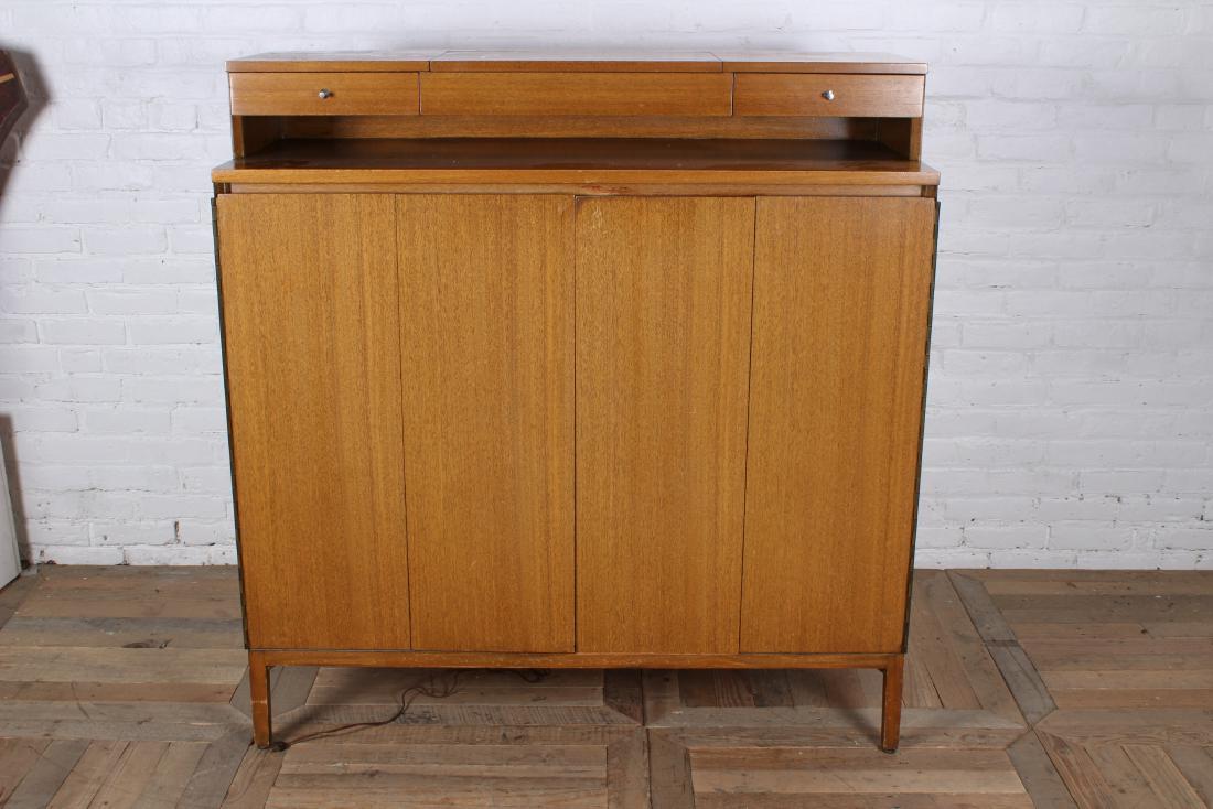 Paul McCobb for Calvin Gentleman's Chest: Paul McCobb for Calvin Gentleman's chest with 2 drawers over 2 bifold doors with fitted interior all raised on tapered legs. Circa 1950. Size: 50" H x 48" W x 19" D
