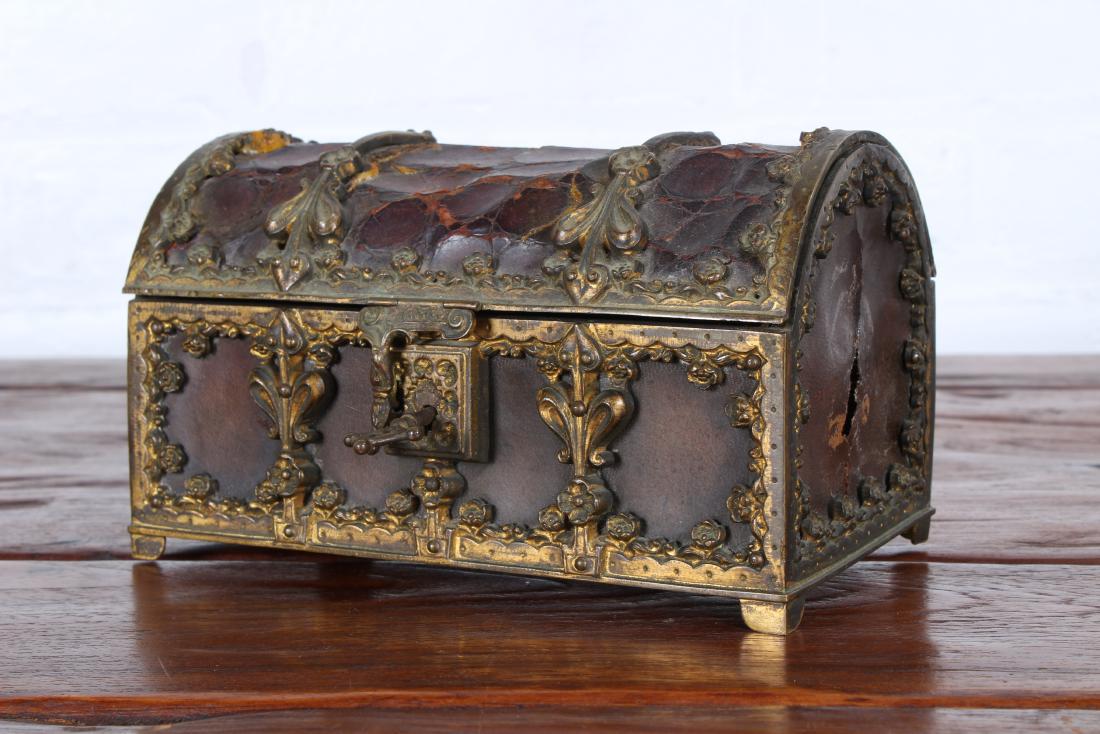 Continental Alligator and Bronze Dressing Box: An interesting Continental alligator and bronze domed top Gothic style dressing box with working key. 19th Century. Size 4 1/2"x 7 1/2"W x 4" D