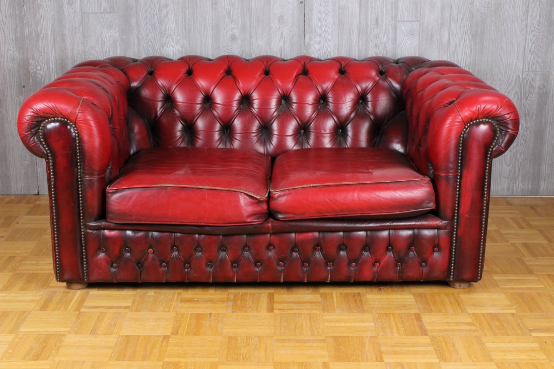 20th century English leather Chesterfield Loveseat: 20th century English leather Chesterfield loveseat with tufted back and arms framing 2 cushion seat. Size: 26 1/2" H x 61 " W x 36" D, Seat Height 16"