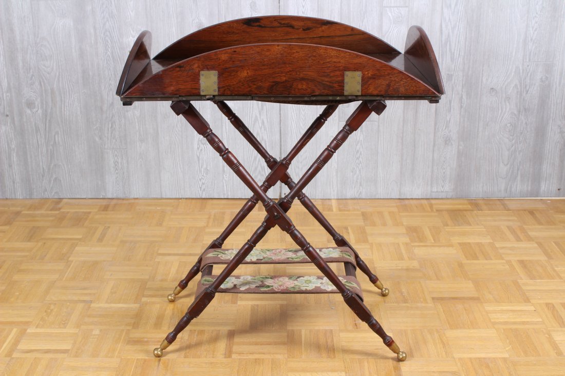 19th century English rosewood campaign butlers tray: 19th century English rosewood campaign butlers tray with brass fittings and folding sides all supported on cross form base. Size: 30" H x 39" W x 30" D