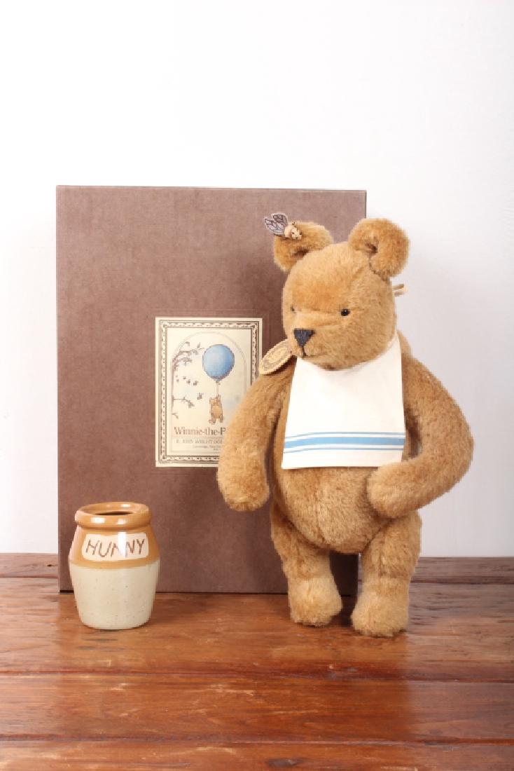 Winnie-the-Pooh Stuffed Doll by R. John Wright: Winnie-the-Pooh Stuffed Doll by R. John Wright Dolls #4882 of 5000 with ceramic "hunny jar" and lid in orginal packaging in excellent condition. The box lid label has a small repaired tear, tags on do