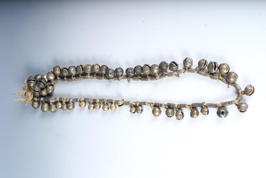 Antique Strand of Bronze Nepalese Bells: Antique Strand of Bronze Nepalese Bells. Size: 14.5" (NN)