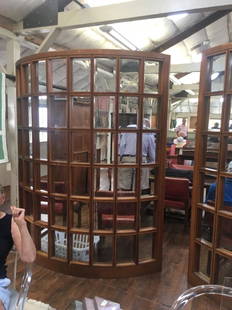 Pair Architectural Mullioned Semi Curved Partition: A pair of curved wood and beveled glass store partitions purportedly the originally form a Ralph Lauren store. Size: 88" x 70" x 3"