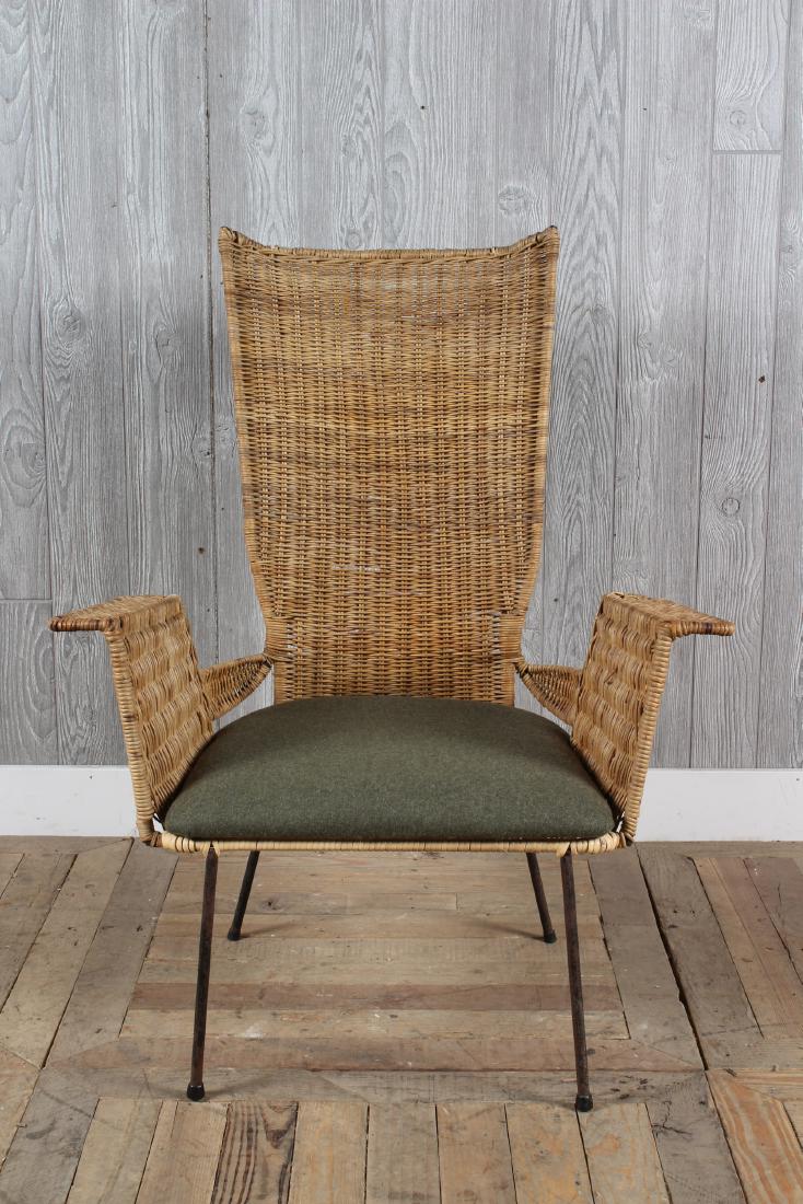 Mid Century Modern Wicker Garden Chair: A mid century modern wrought and wicker garden chair having flared arms framing upholstered seat, circa 1950. Size: 37" x 29" x 24"