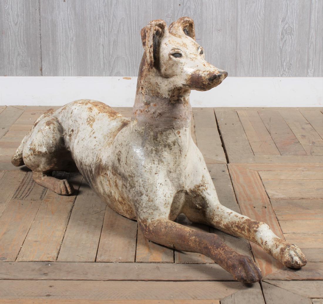 Cast Iron Whippet: A good late 19th century American cast iron recumbent whippet having elegant presence and well detailed structure, remains of painted surface. Size: 18" x 9" x 38"