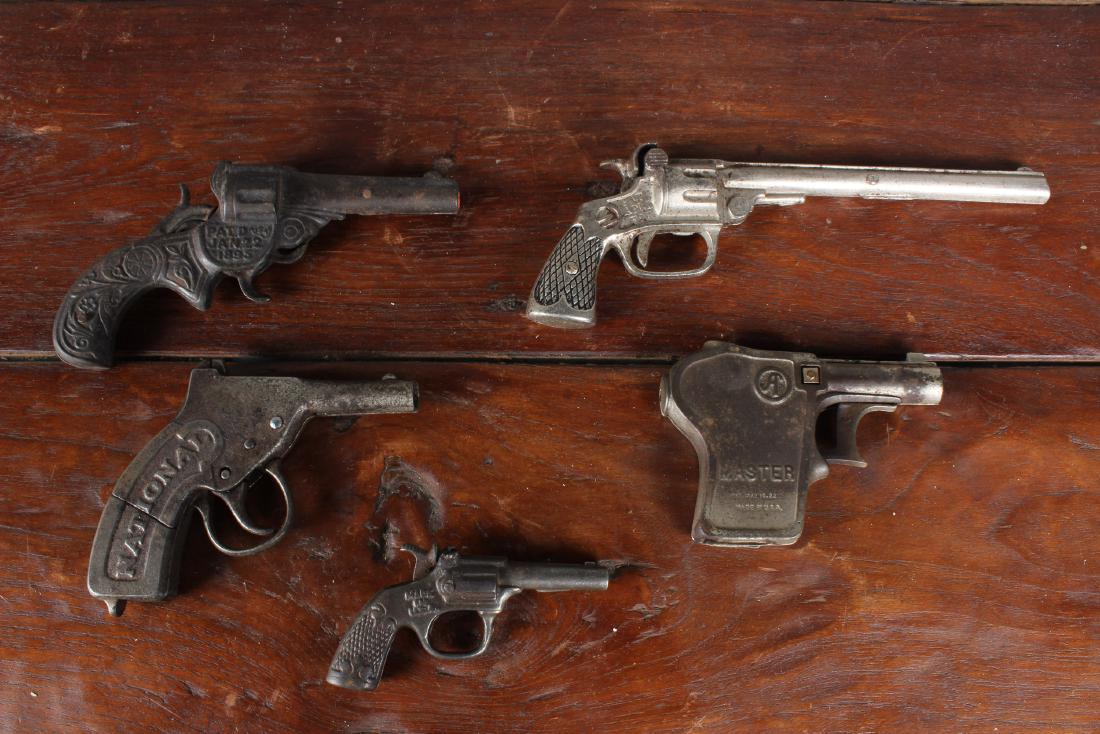 5 Vintage Cast Iron Toy Cap Guns: 5 Vintage Cast Iron Toy Cap Guns. Size: 9" x 3" x 1"