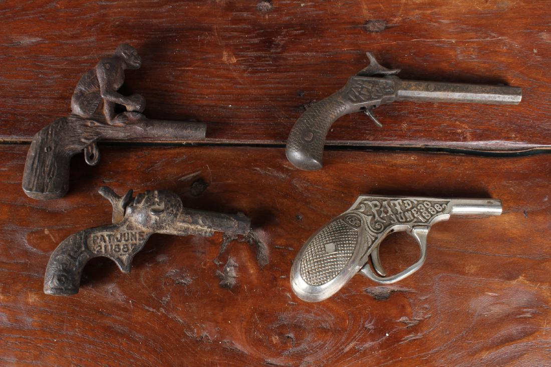 Collection of 4 Early Toy Cap Guns: Collection of 4 Early Toy Cap Guns. Including Sambo and Liquid Pistol. Size: 5.5" x 3" x .5"