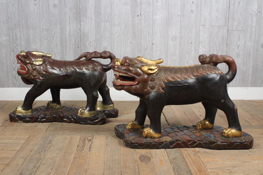 Pair Chinese Carved Wood Guardian Qilin: Pair Chinese Carved Wood Guardian Qilin, Kylin. Size: 19" H x 10.5" W x 28" D
