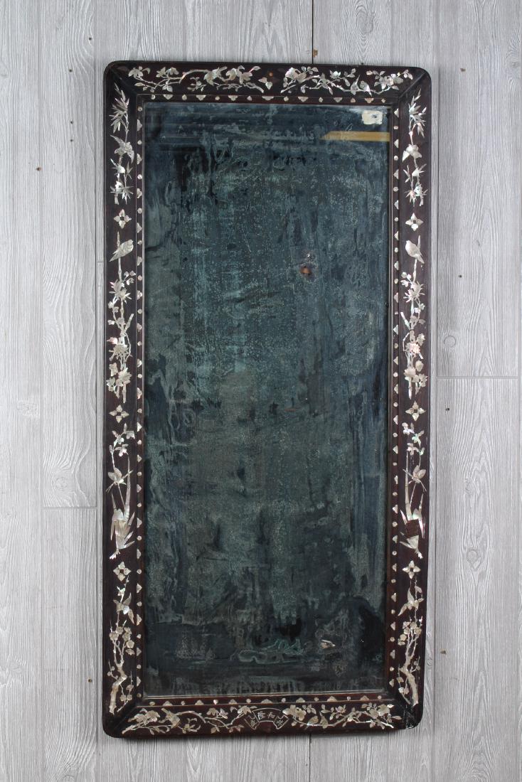 Mother of Pearl Inlaid Chinese Mirror: Chinese mother of pearl inlaid hard wood mirror. Size: 49" H x 24" W x 1.5" D