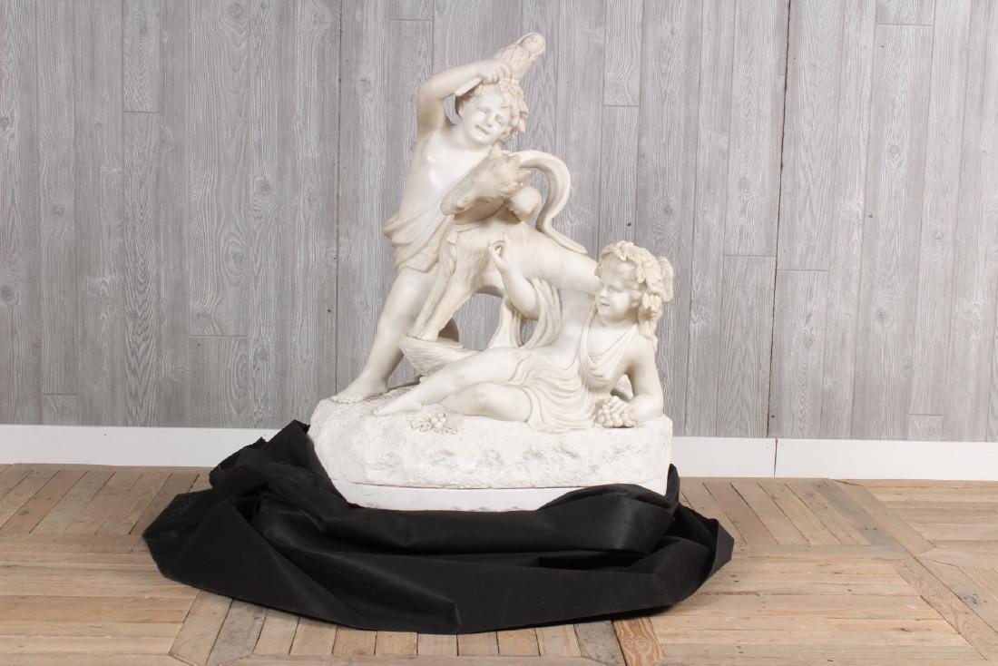 After Clodion Marble Sculpture: A Large carved marble figural sculpture of frolicking Putti resting on naturalistic base after Clodion. Size: 40" x 36" x 18"