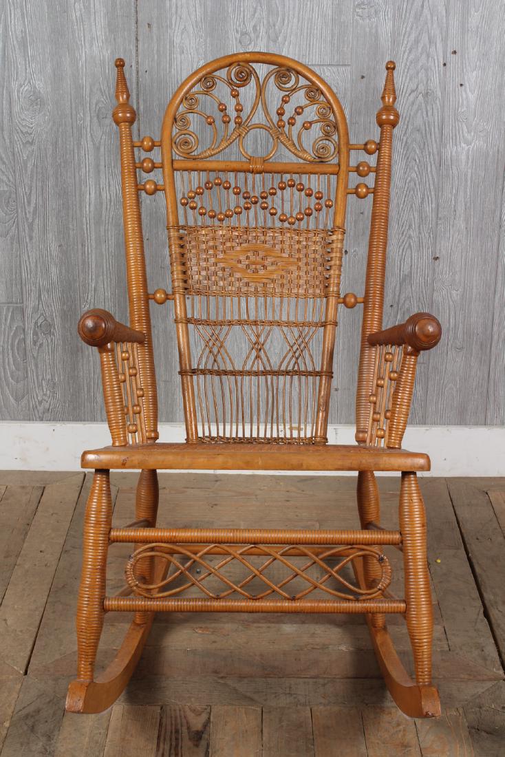 Wakefield Rattan Rocker: A Heywood Wakefield Victorian ornate rocker. Size: 36" H x 19" W x 30" D