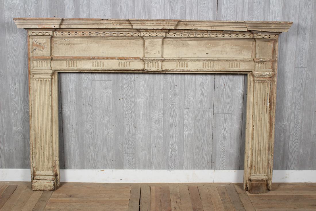 Antique American Carved Mantel: A late 18th, early 19th century American carved mantle with stepped cornice and carved details. Size: 53" H x 80" W x 7.5" D