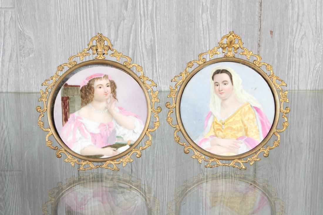 Pair KPM Style Portraits: A pair of KPM style panting on porcelain mounted in Rococo style brass frames. Size: 8" H x 7" W