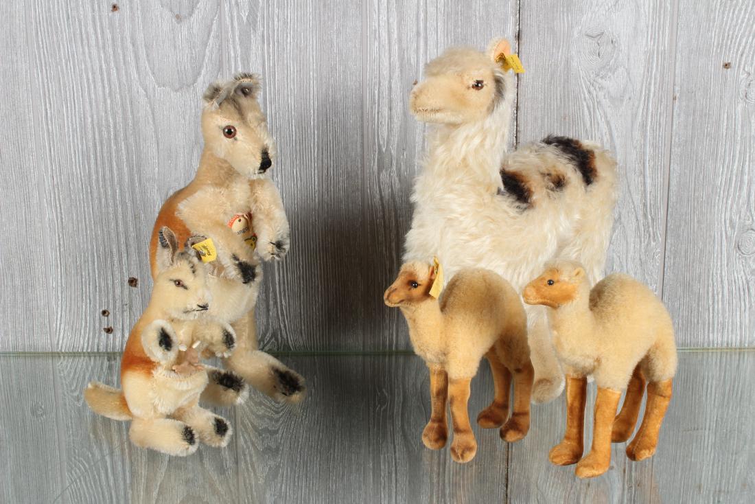 Five Vintage Steiff Figurines: Five Vintage Steiff Figurines. Includes two Kangaroos with one Joey. Taller kangaroo has chest label and button in ear, and smaller kangroo has button and tag in ear, 4314.00. Llama with button and ta