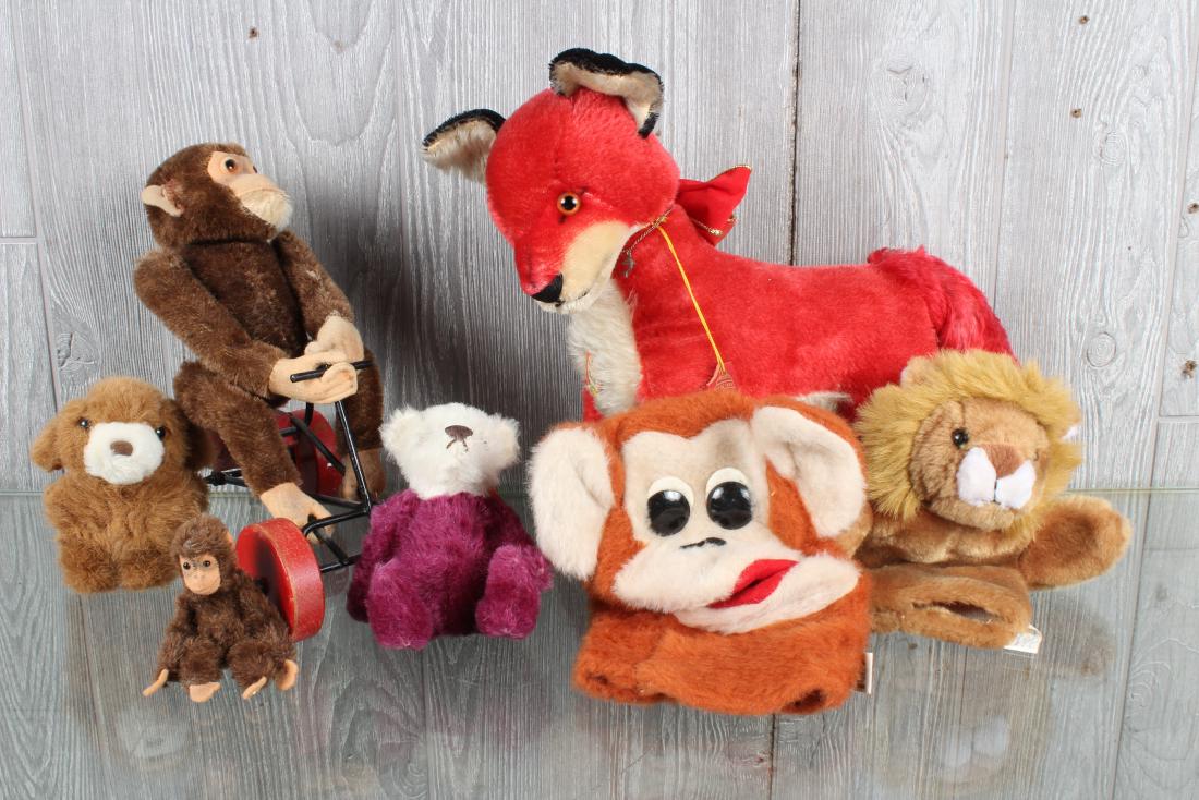 Plush Toys Group including Steiff: Including Jocko on wheels, puppets, and Red Fox with wooden FAO Schwartz hang tag. Size: Largest: 12" H x 6" W x 14" D