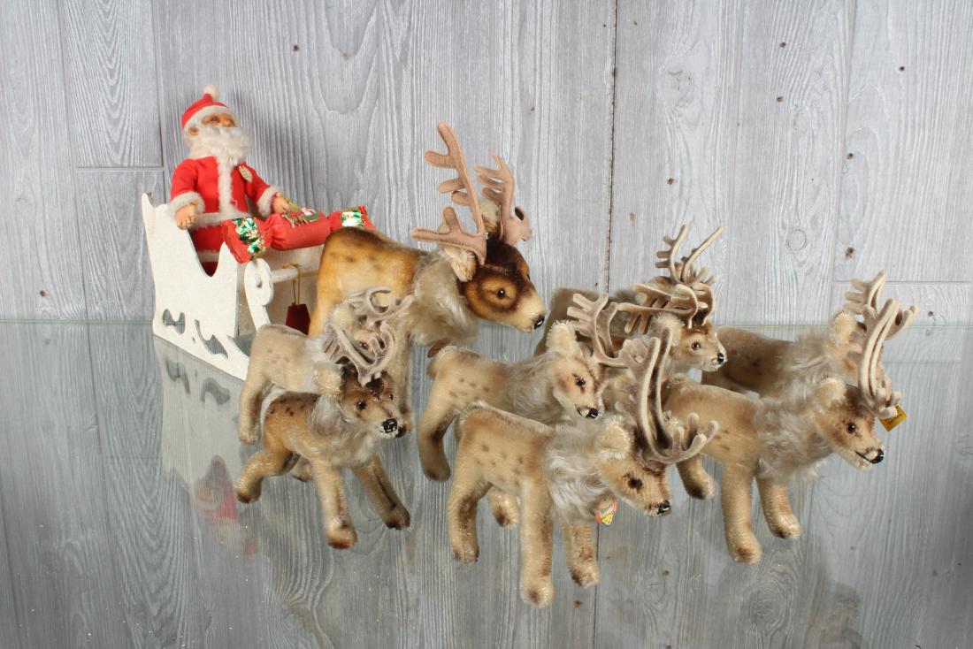 Steiff Santa Claus with Nine Reindeer in Sleigh: Steiff Santa Claus with Nine Reindeer in Sleigh, Steiff Santa Claus with chest label and button and tag, nine Steiff Renny reindeer figurines, one larger the the rest, with chest label, no button, two