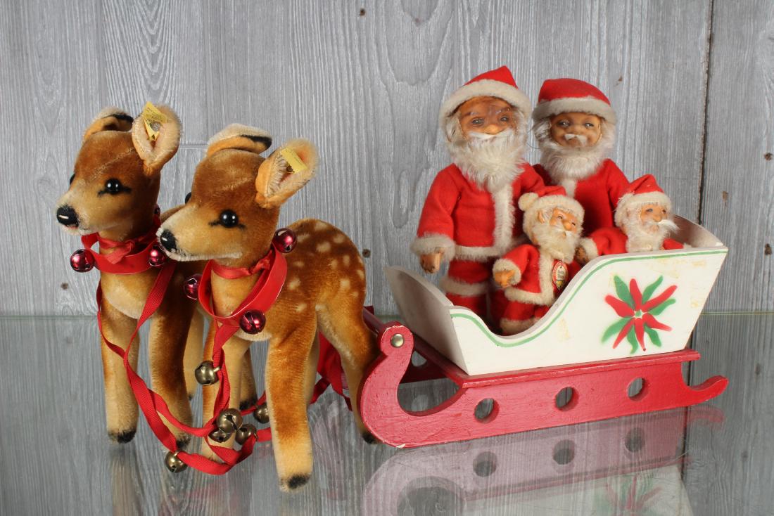 Steiff Santa Claus Figurines and Deer in Sleigh: Steiff Santa Claus Figurines and Deer in Sleigh, four Steiff Santa Claus figurines, two smaller Santas with chest label and button and tags, one larger Santa with button and tag, two Steiff Deer figur