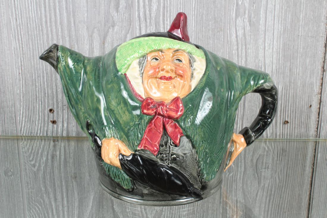 Royal Doulton Sarah Gamp Teapot: Royal Doulton Sarah Gamp Teapot, porcelain, with lid, marked on bottom. Size: 7.5" H x 9.5" W x 6" D