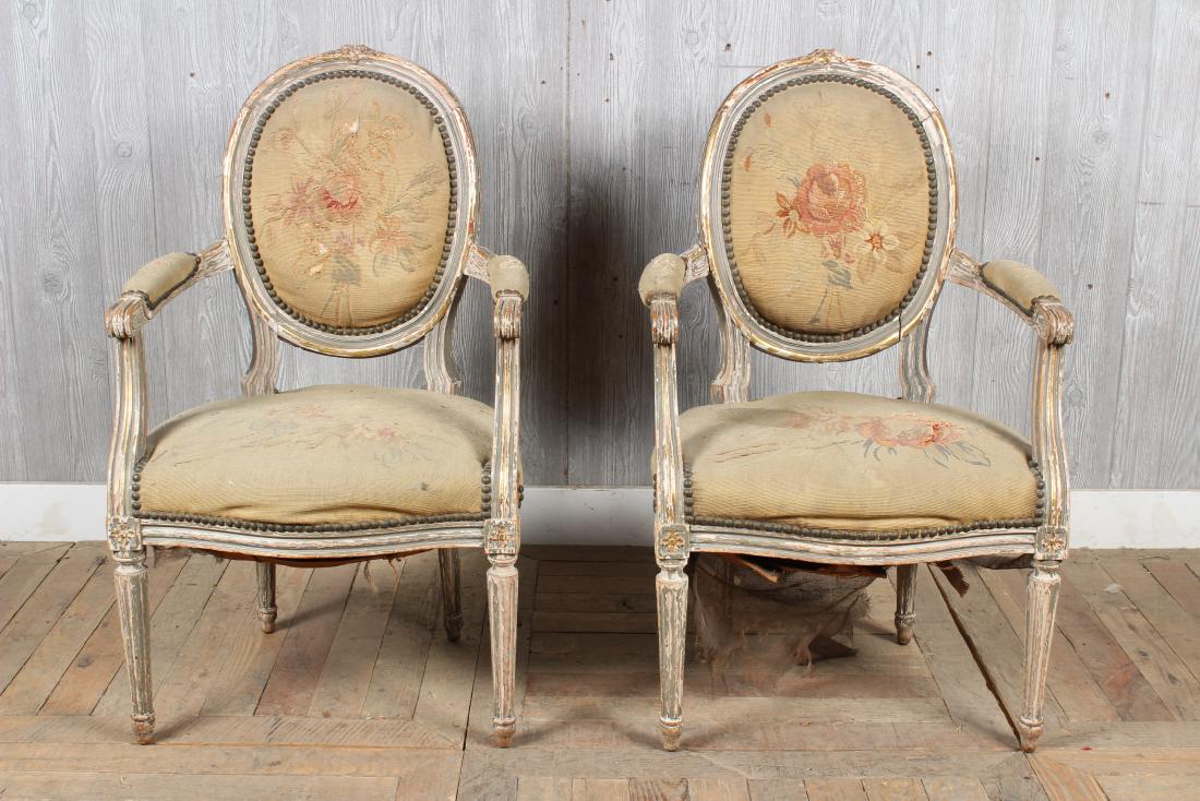 Pair Louis XVI Style Needlepoint Armchairs: Pair Louis XVI Style Needlepoint Armchairs, carved and painted with aubusson back and seat covers. Size: 35.5" H x 21.5" W x 22" D