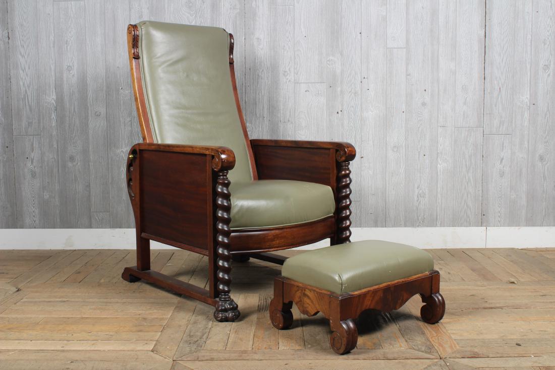 Morris Chair and Ottoman: A late 19th C. Morris chair having a reclining back and upholstered seat framed by barley twist supports and an associated ottoman. Size: 43" H x 28" W x 30" D