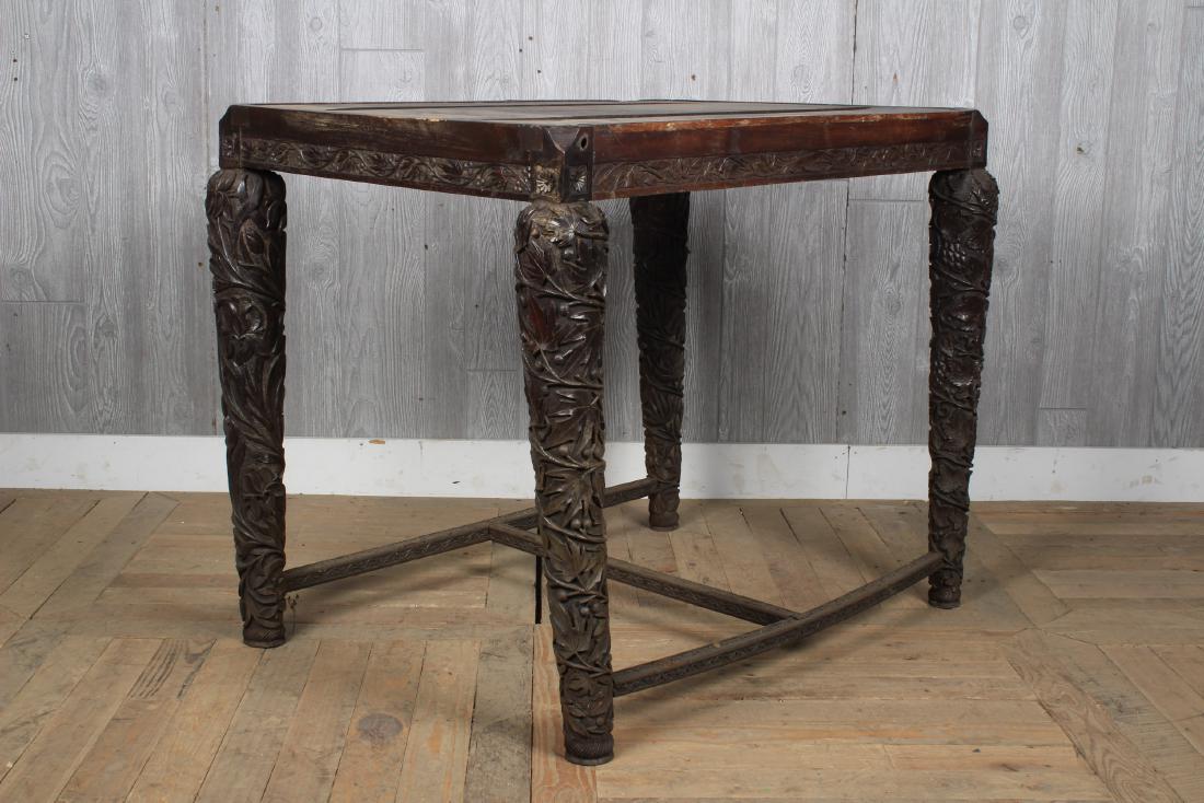 Carved Continental Table: A carved hard wood table (no top) with elaborately carved tapers legs. Size: 30.5" H x 36" W x 26" D