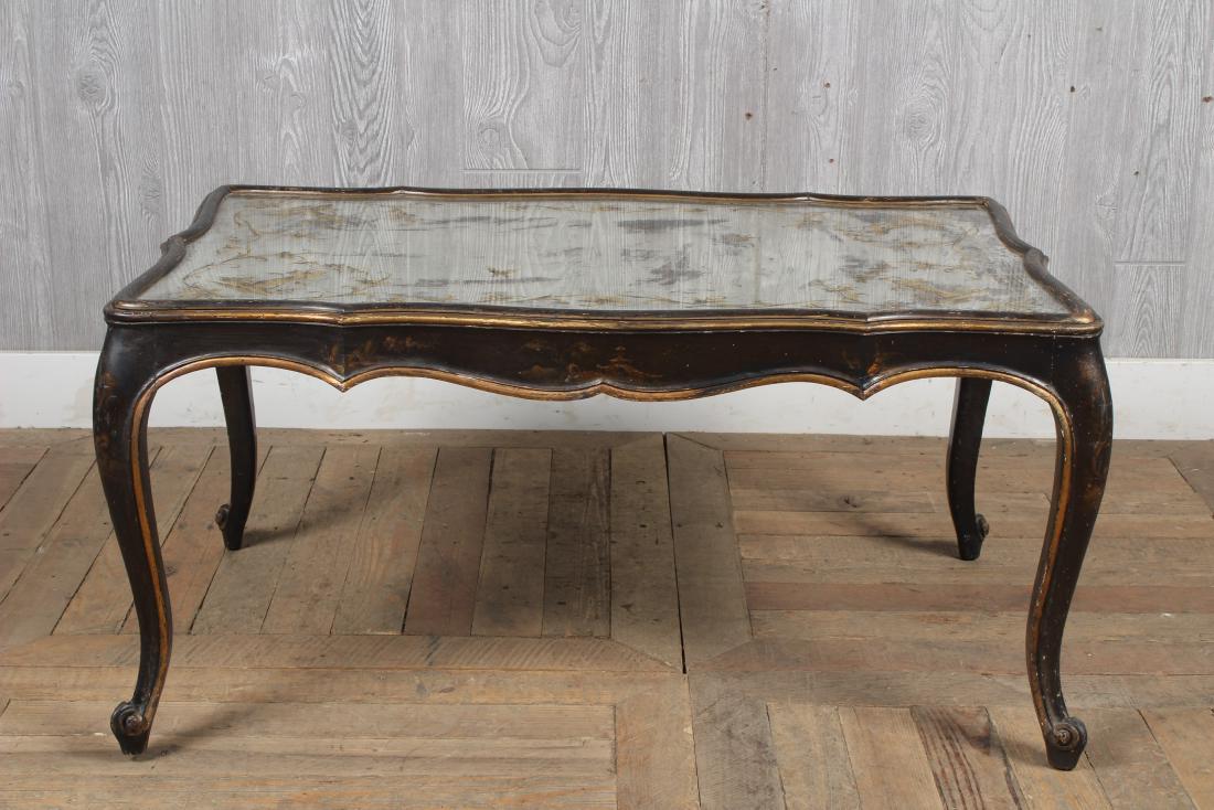 Silvered Top Chinoiserie Coffee Table: A Maison Jansen attributed Louis XV style painted coffee table with elongated decorated mirror top over a scalloped apron and cabriole legs. Size: 18" H x 36" W x 22" D