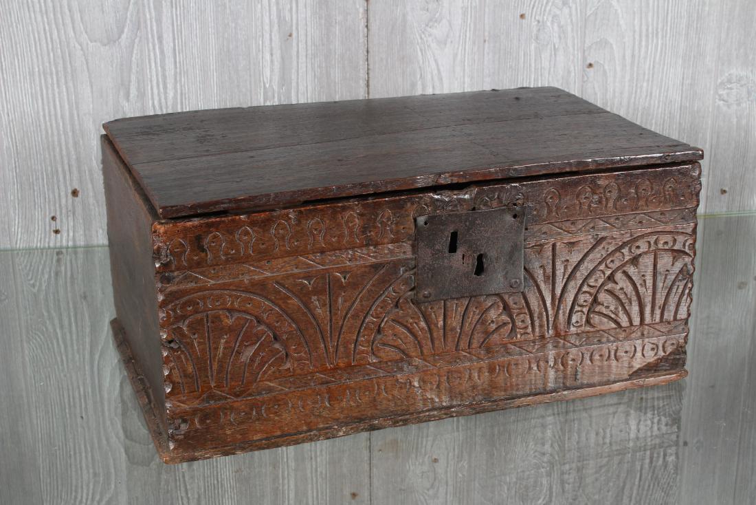 Antique Carved Wooden Casket or Glove Box: Carved Wooden Casket or Glove Box, carved decoration on front, iron hinges and lock. Size: 8.5" H x 18" W x 11.5" D