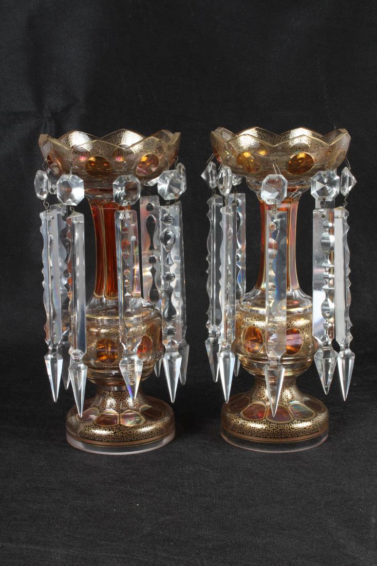 Pair of Bohemian Glass Mantle Lusters: Pair of Bohemian Glass Lustres, gilt and amber glass, 8 prisms on each. Size: 12.5" H x 6" W x 6" D