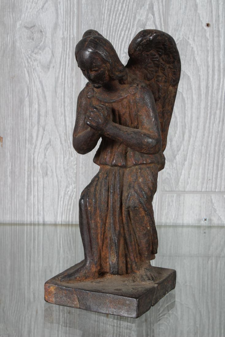 Antique French Cast Iron Angel Statue: French 19th century or earlier cast iron figure of a winged angel with frayed tunic. Size: 10.5" H x 4" W x 4" D