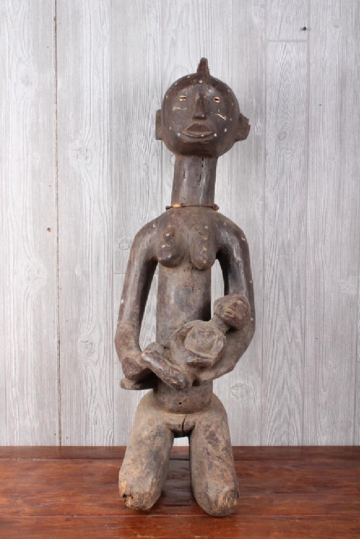 Tabwa Culture Maternity Figure: Tabwa Culture Maternity Figure. Carved wood.