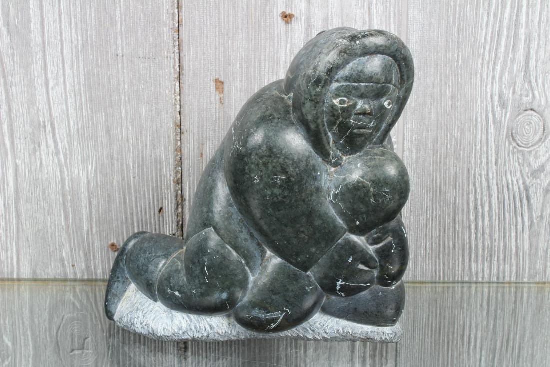 Signed Inuit Carved Soapstone Figural Group: Inuit Carved Soapstone Figural Group. Numbered on bottom 28657. Size: 6.5" H x 6.5" W x 3" D