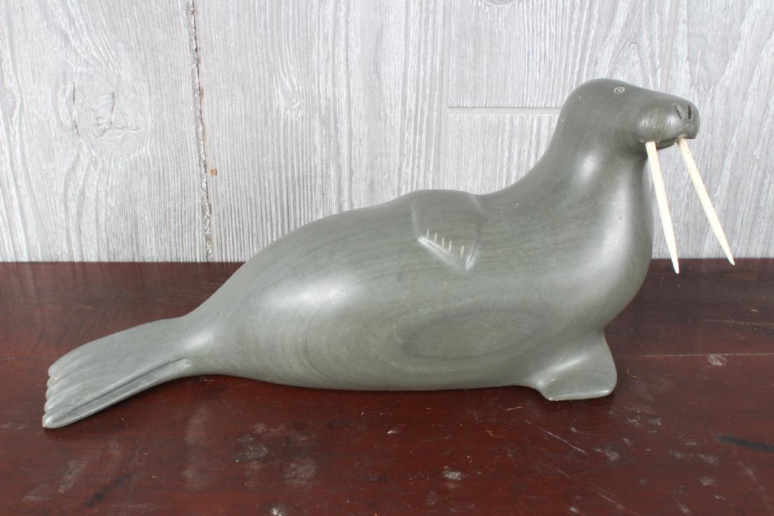 Inuit Carved Soapstone Walrus: Inuit Carved Soapstone Walrus. Bearing Disc Number E9-156. Size: 5" H x 11" W x 4" D
